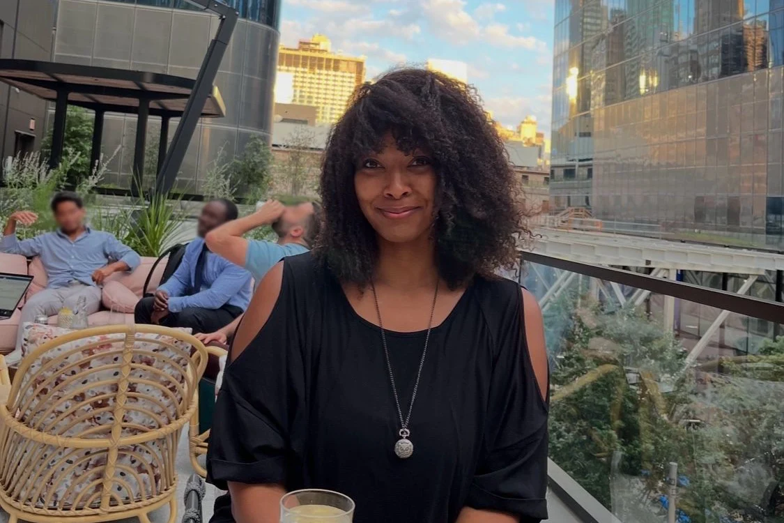 Black web designer on rooftop in NYC